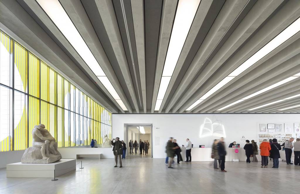 Image: Interior view of Turner Contemporary Gallery with patrons looking at art, image courtesy of Turner Contemporary