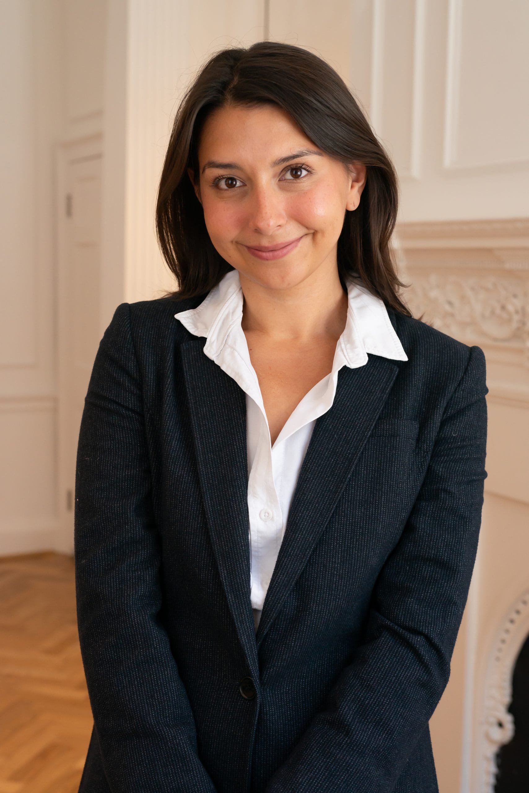 Image: Rebecca Davison-Mora, Communications and New Business, BOP Consulting, standing in the BOP offices.